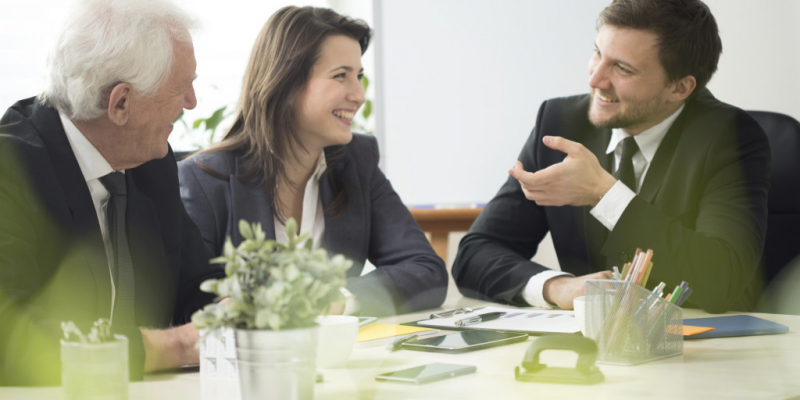 three employees in conversation