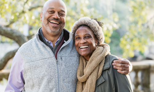 Senior couple smiling outdoors