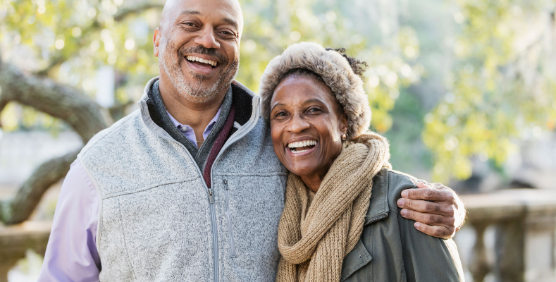 Senior couple smiling outdoors