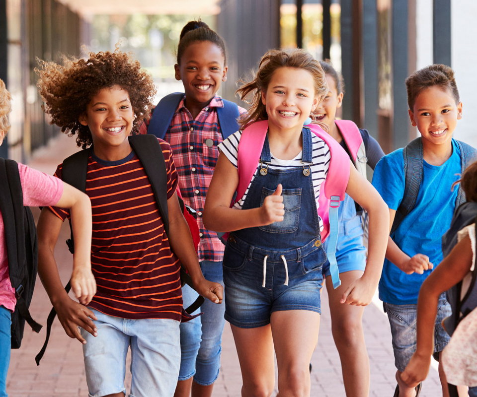 Group of school children running